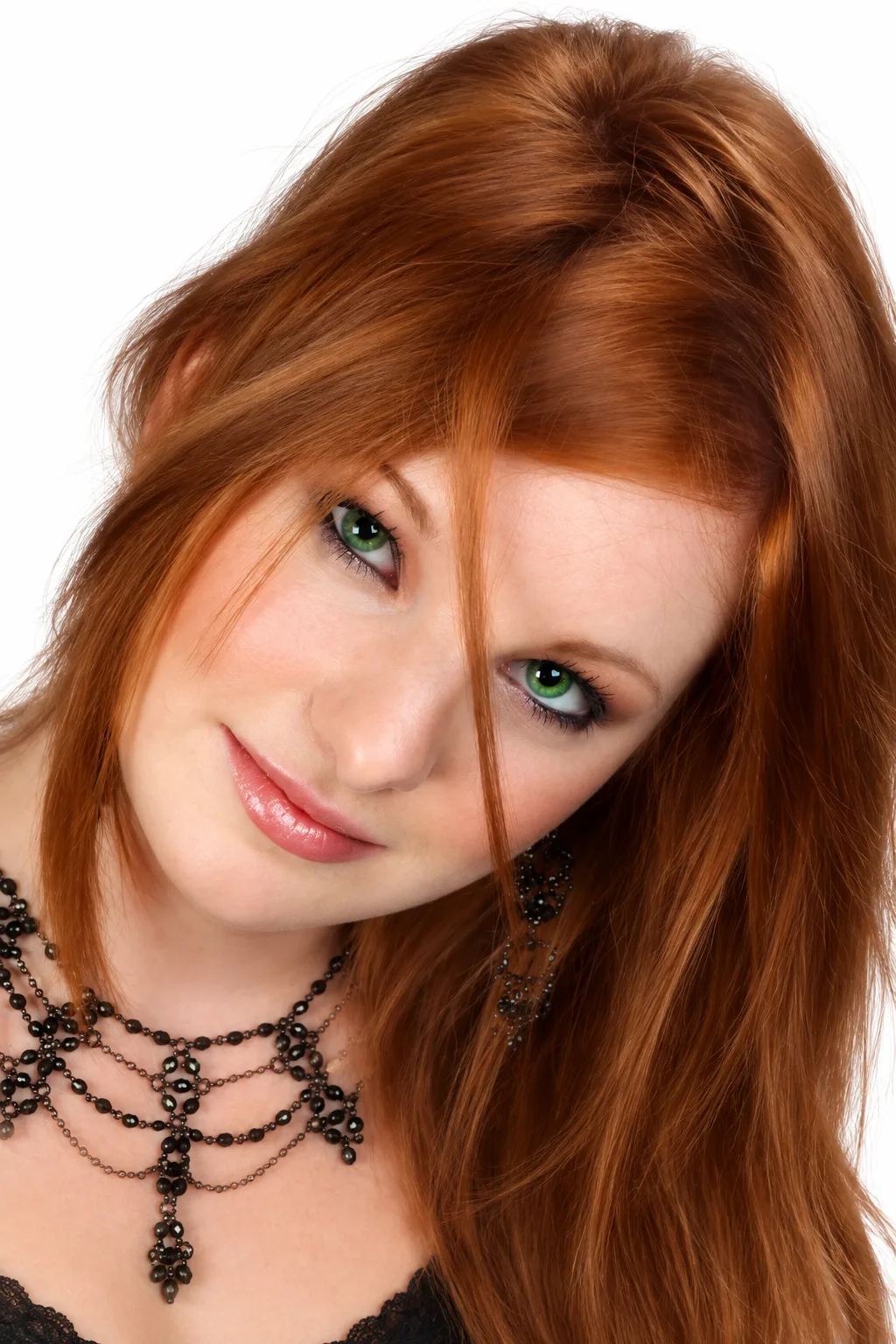 Red-haired woman in a polished white-background profile portrait