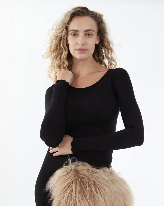 Natural model portfolio headshot in a simple black top